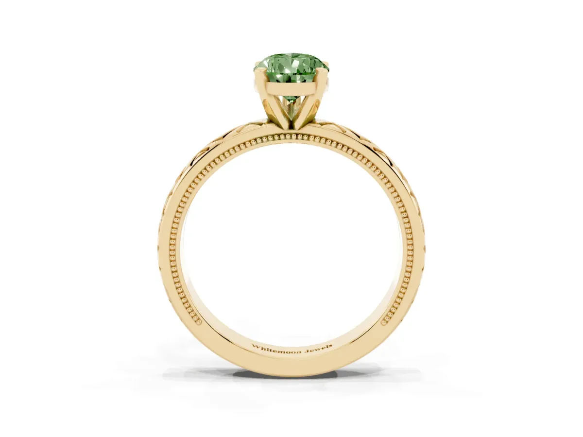 Fancy Green Pear Cut Solitaire Diamond Ring with Milgrain and Black Enamel X Pattern Band Yellow gold