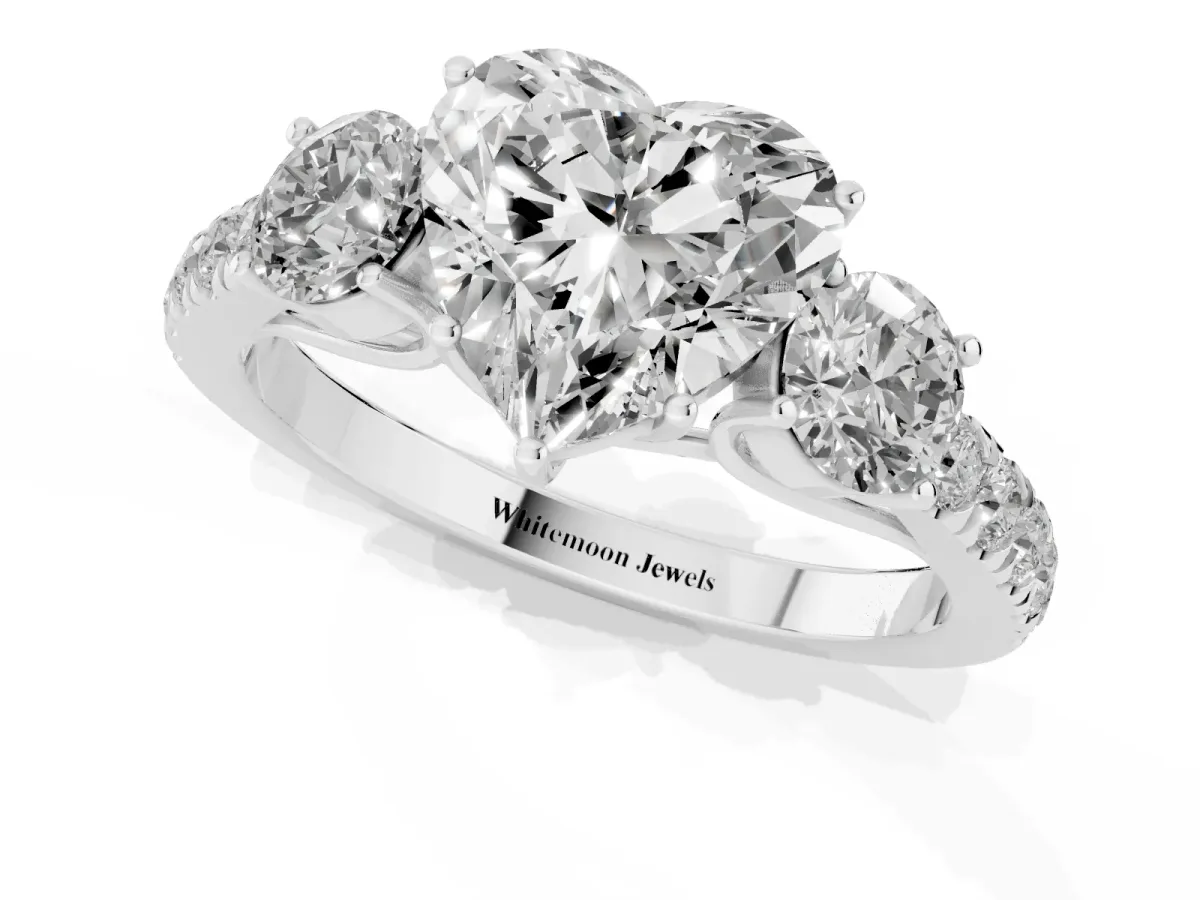 Heart Cut Cut Diamond Three-Stone Ring with Round Side Stones and Pavé Band Silver