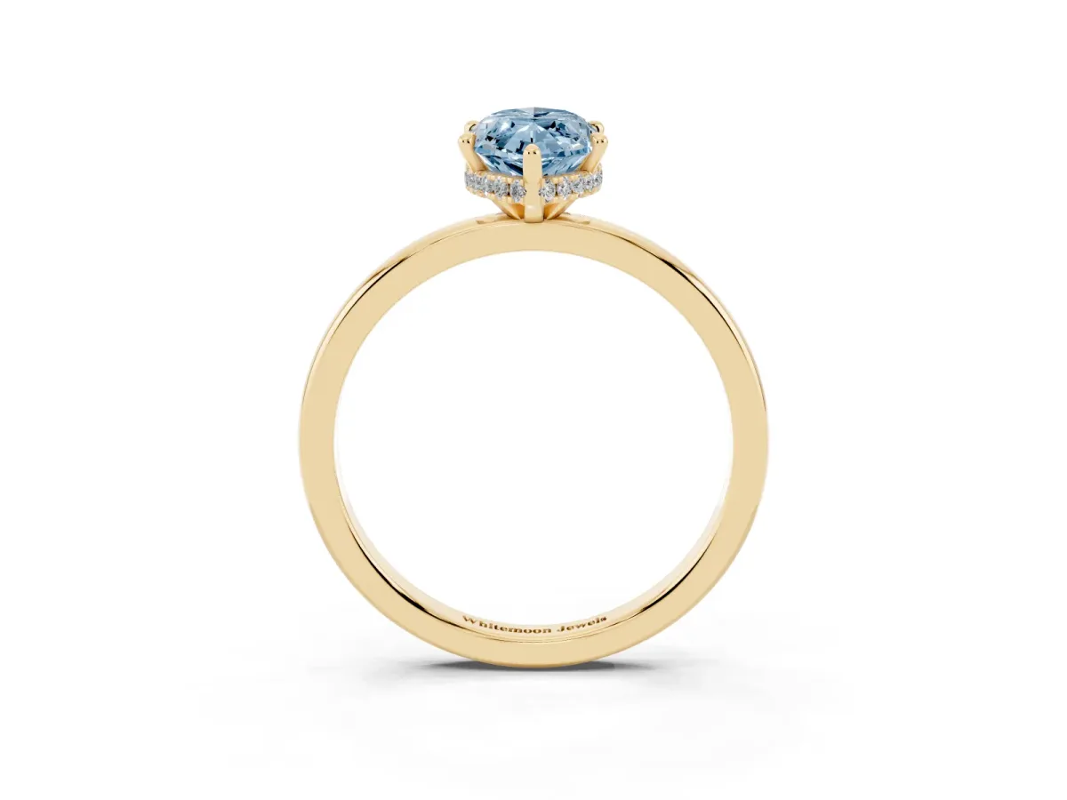 Fancy Blue Marquise Cut Solitaire Engagement Ring with Cathedral Band and Four-Prong Setting Yellow gold