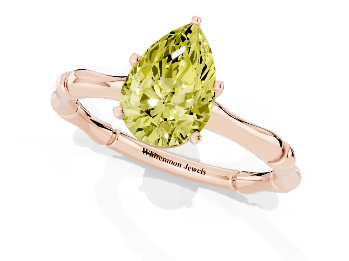 Fancy Yellow Pear Cut Solitaire Diamond Ring with Bamboo Band and Four-Prong Setting Rose gold