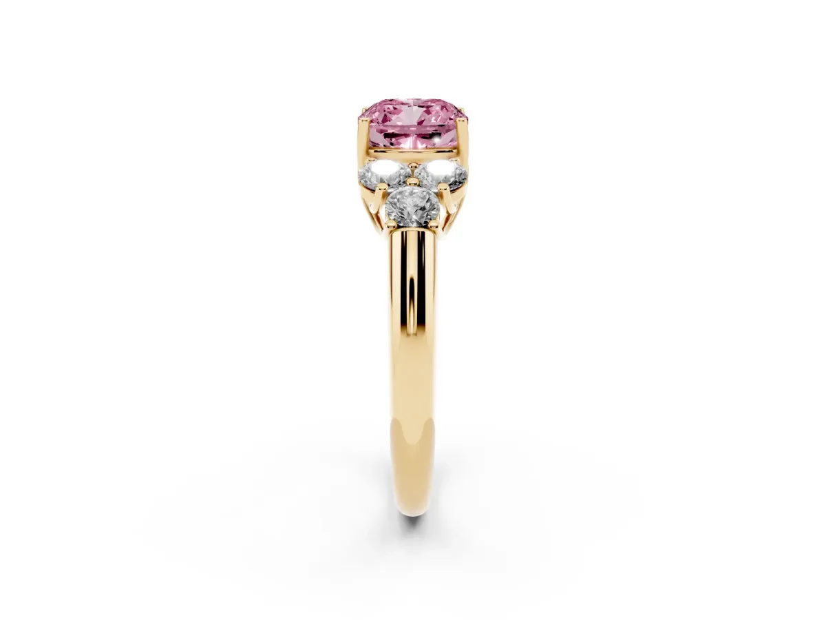 Fancy Pink Cushion Cut Cut Diamond Cluster Ring with Round Accent Stones and Prong Setting on a Classic Band Yellow gold