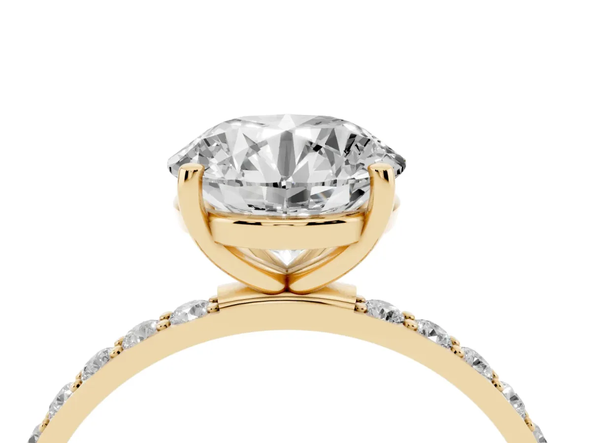 Round Cut Diamond Solitaire Ring with Round Pavé Shoulders and Prong Setting Yellow gold