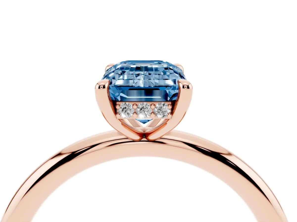 Fancy Blue Emerald Cut Diamond Solitaire Ring with Thin Band and Four-Prong Setting Rose gold