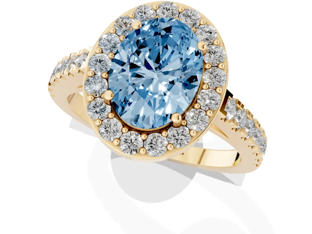 Fancy Blue Oval Cut Diamond Halo Ring with Round Pavé Split Shank and Prong Setting Yellow gold