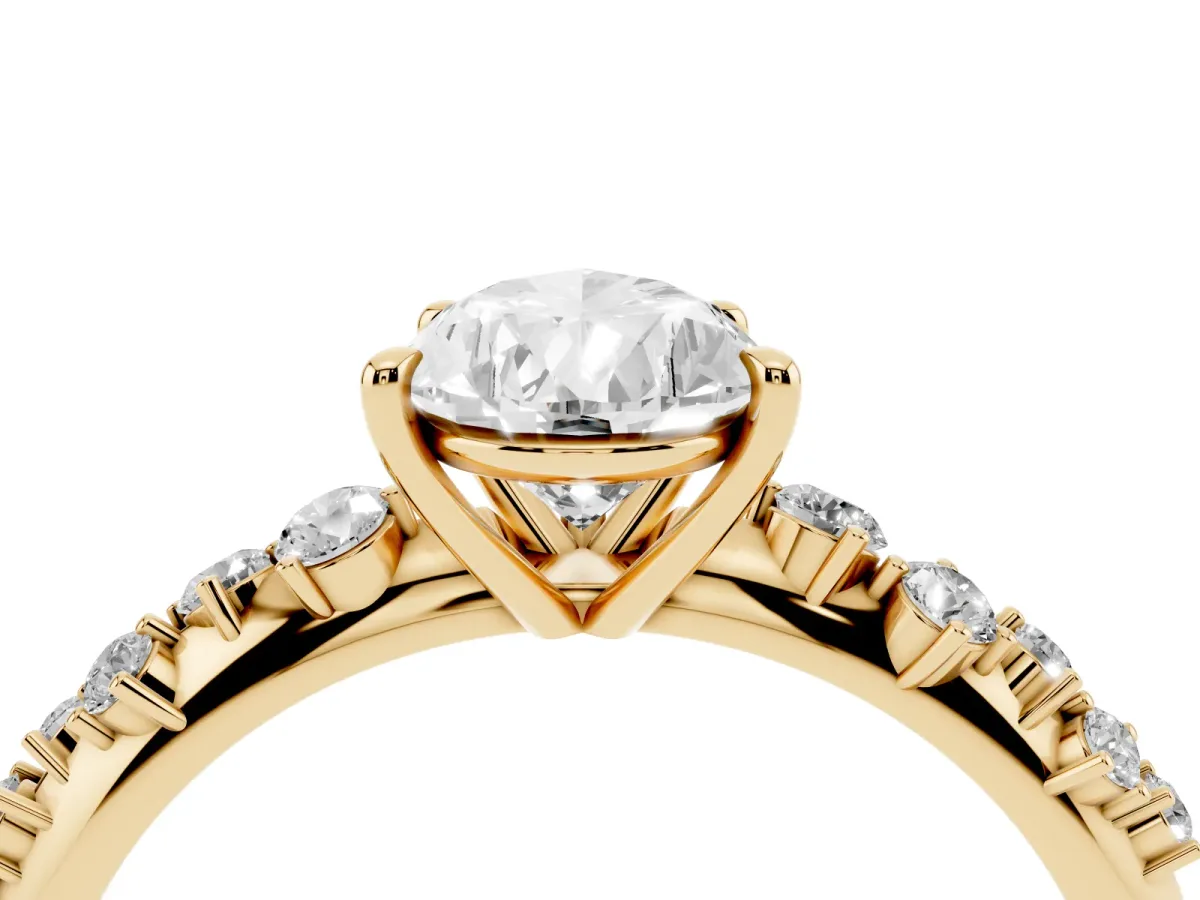 Pear Cut Diamond Cluster Side Stone Solitaire Ring with Prong Setting Yellow gold