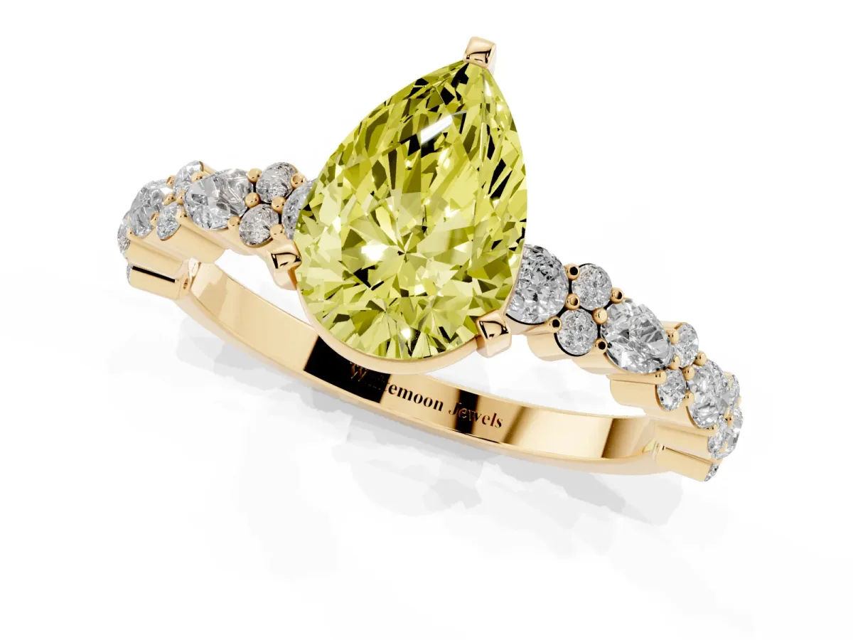Fancy Yellow Pear Cut Diamond Side Stone Solitaire Ring with Round and Four-Prong Setting Yellow gold