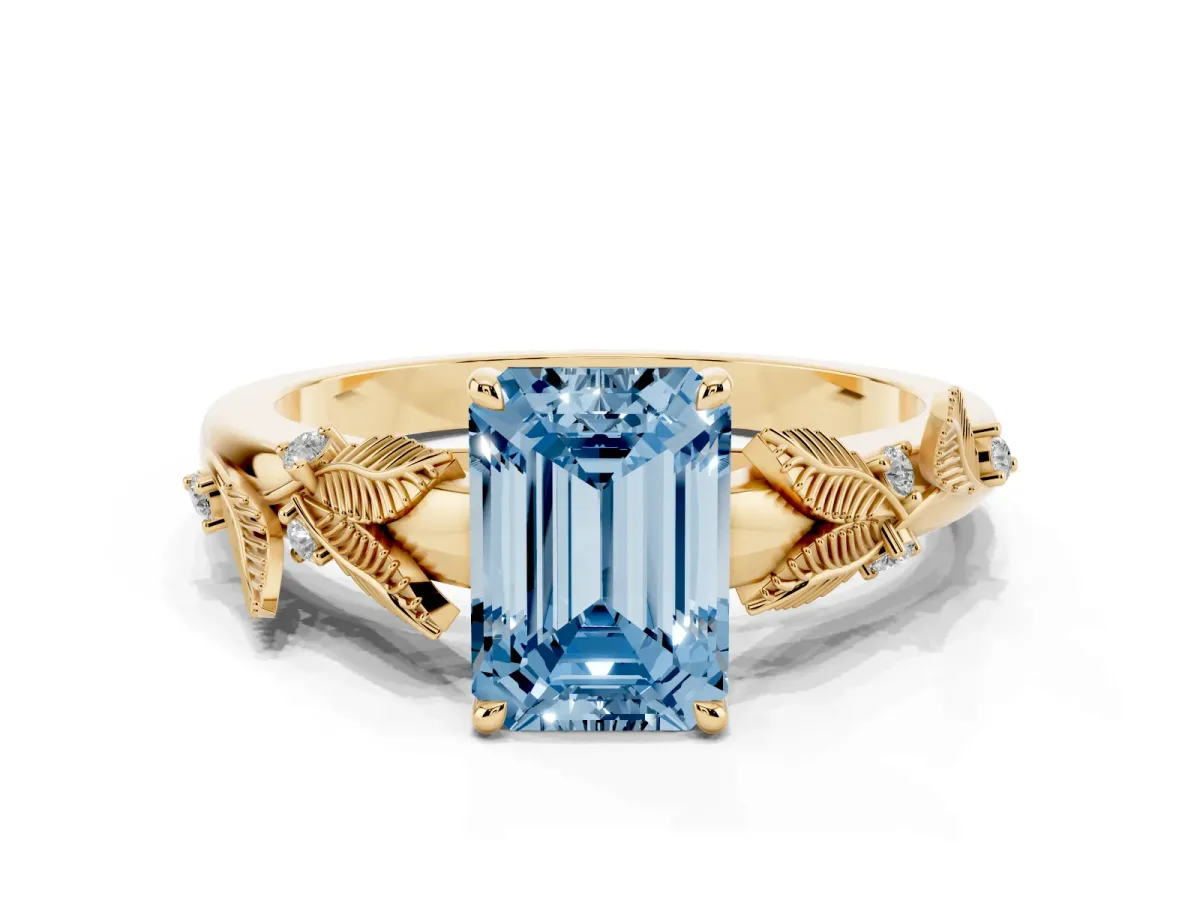 Fancy Blue Emerald Cut Diamond Solitaire Ring with Leaf Motif Band and Four-Prong Setting Yellow gold
