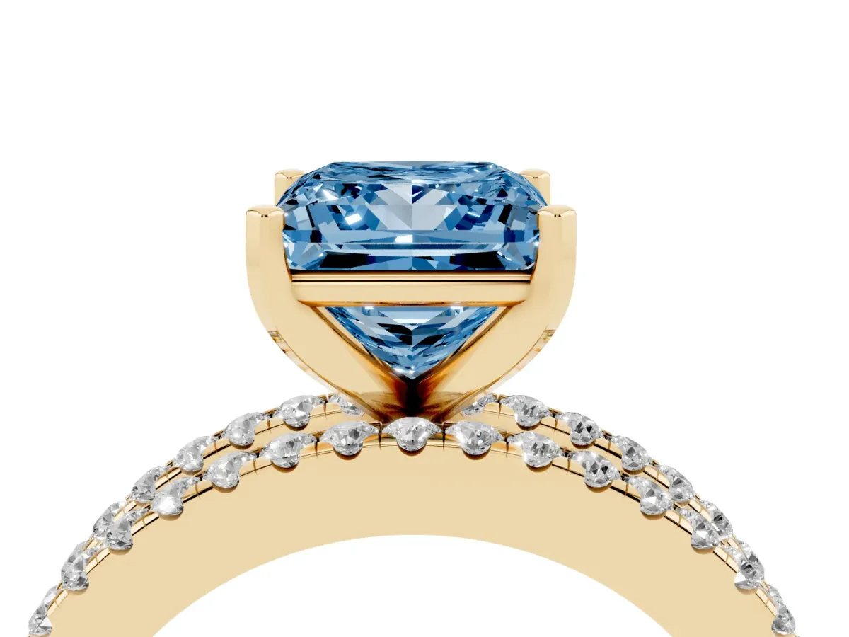 Fancy Blue Princess Cut Diamond Solitaire Ring with Pavé and Channel Set Band Yellow gold