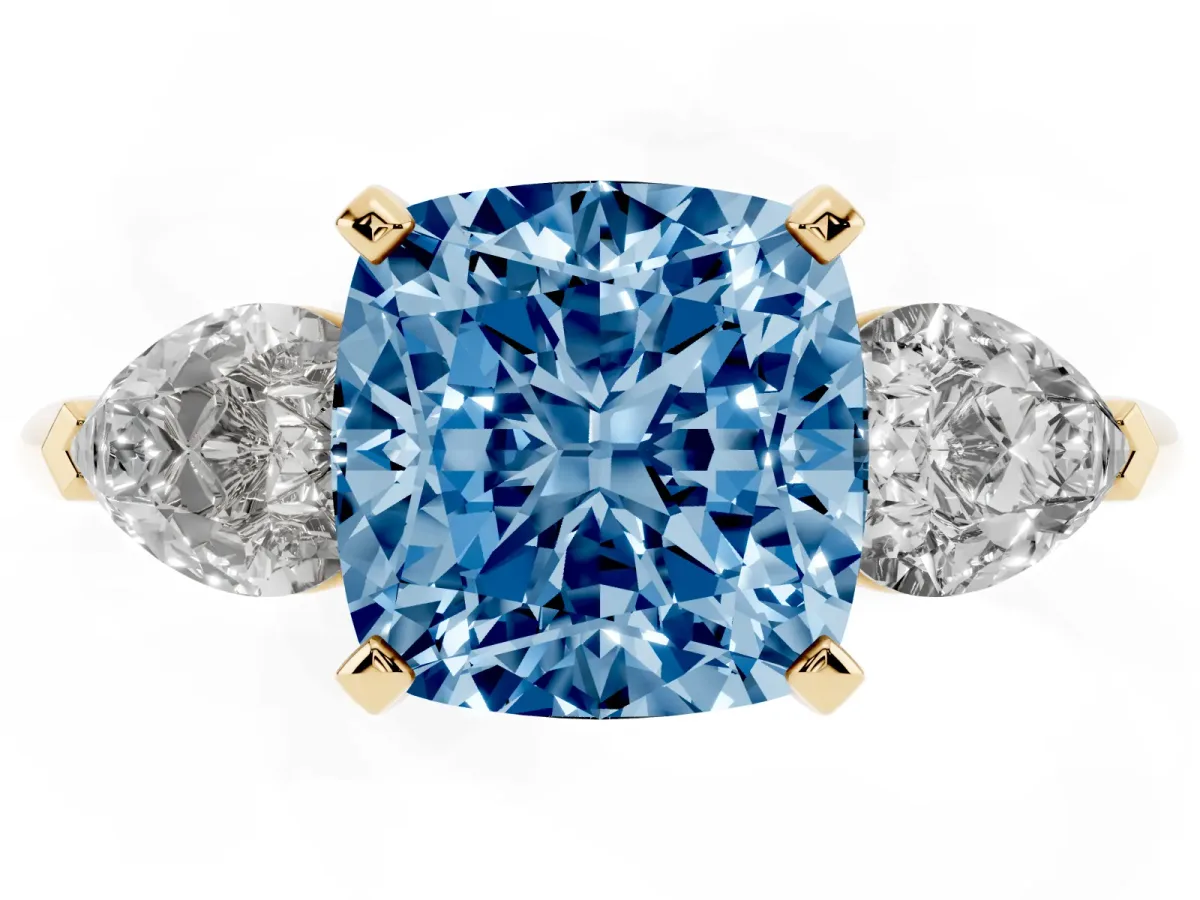 Fancy Blue Three-Stone Cushion Cut Diamond Ring with Pear Side Stones and Four-Prong Setting Yellow gold