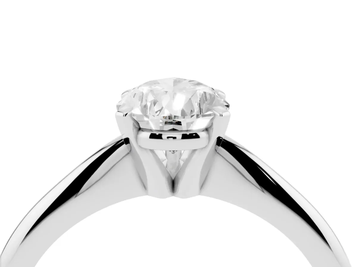 Pear Cut Cut Solitaire Ring with Four-Prong Setting on a Classic Band Silver