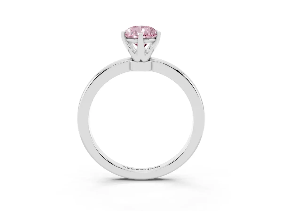Fancy Pink Pear Cut Solitaire Diamond Ring with Six-Prong Setting on a Classic Band Silver