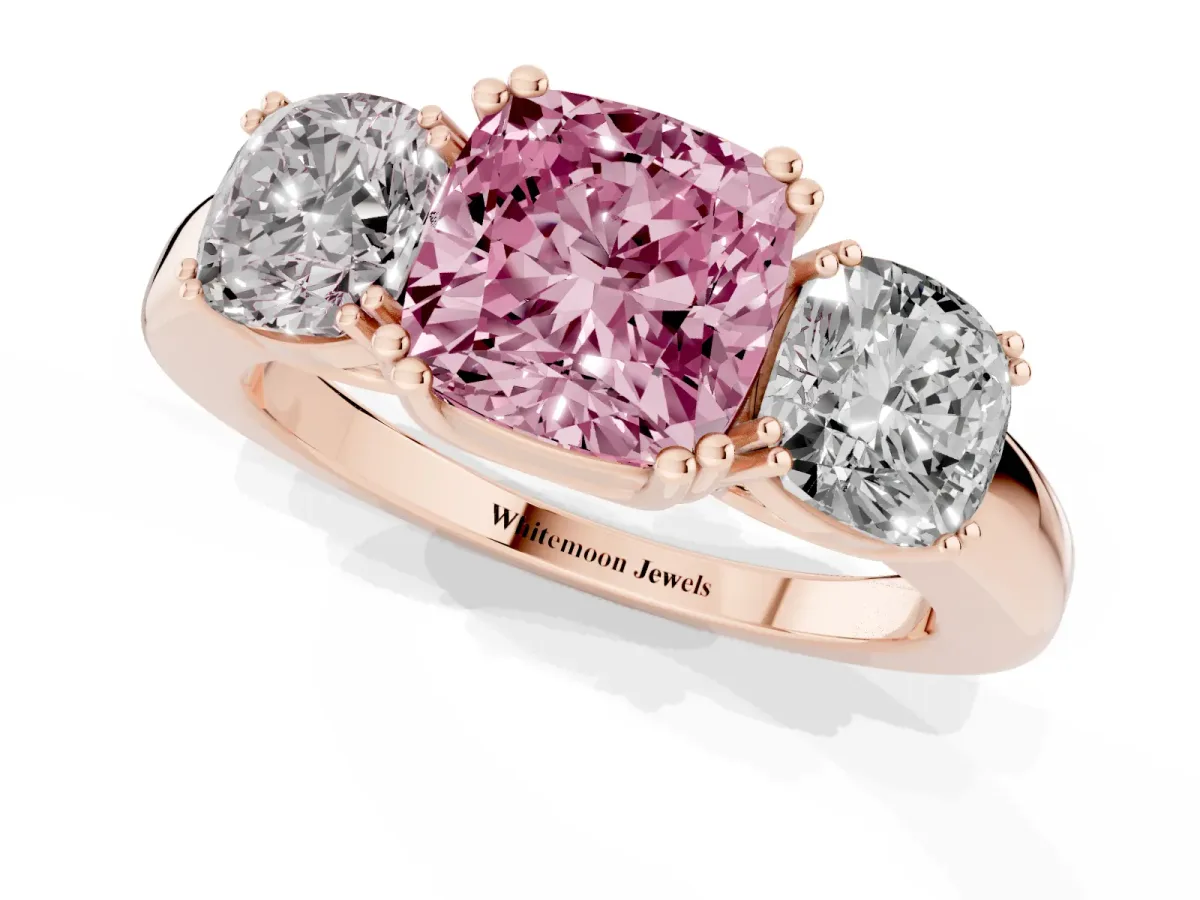 Fancy Pink Three-Stone Cushion Cut Cut Diamond Ring with Channel Set Band and Four-Prong Setting Rose gold