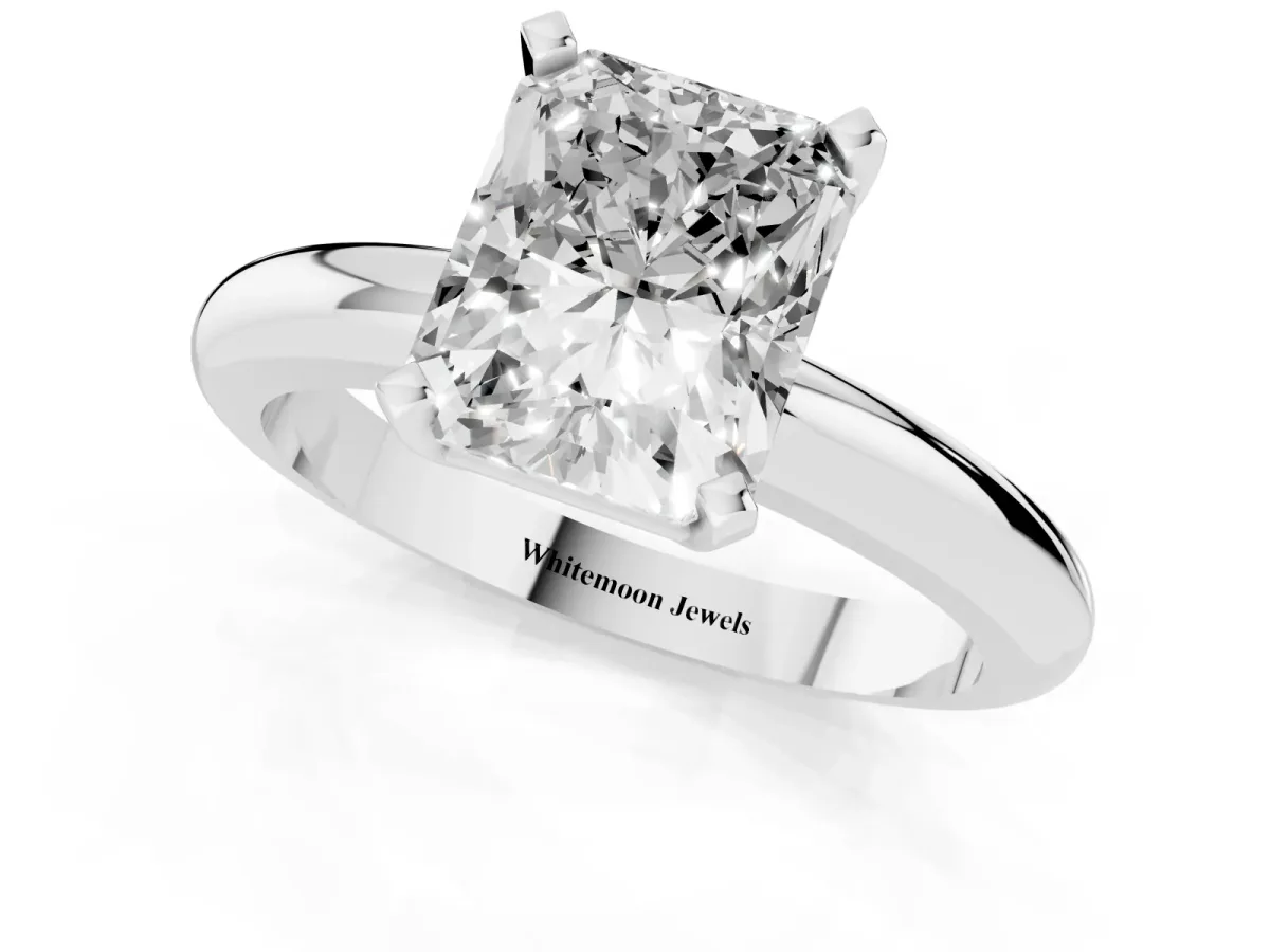Radiant Cut Diamond Solitaire Engagement Ring with Round Band and Four-Prong Setting Silver