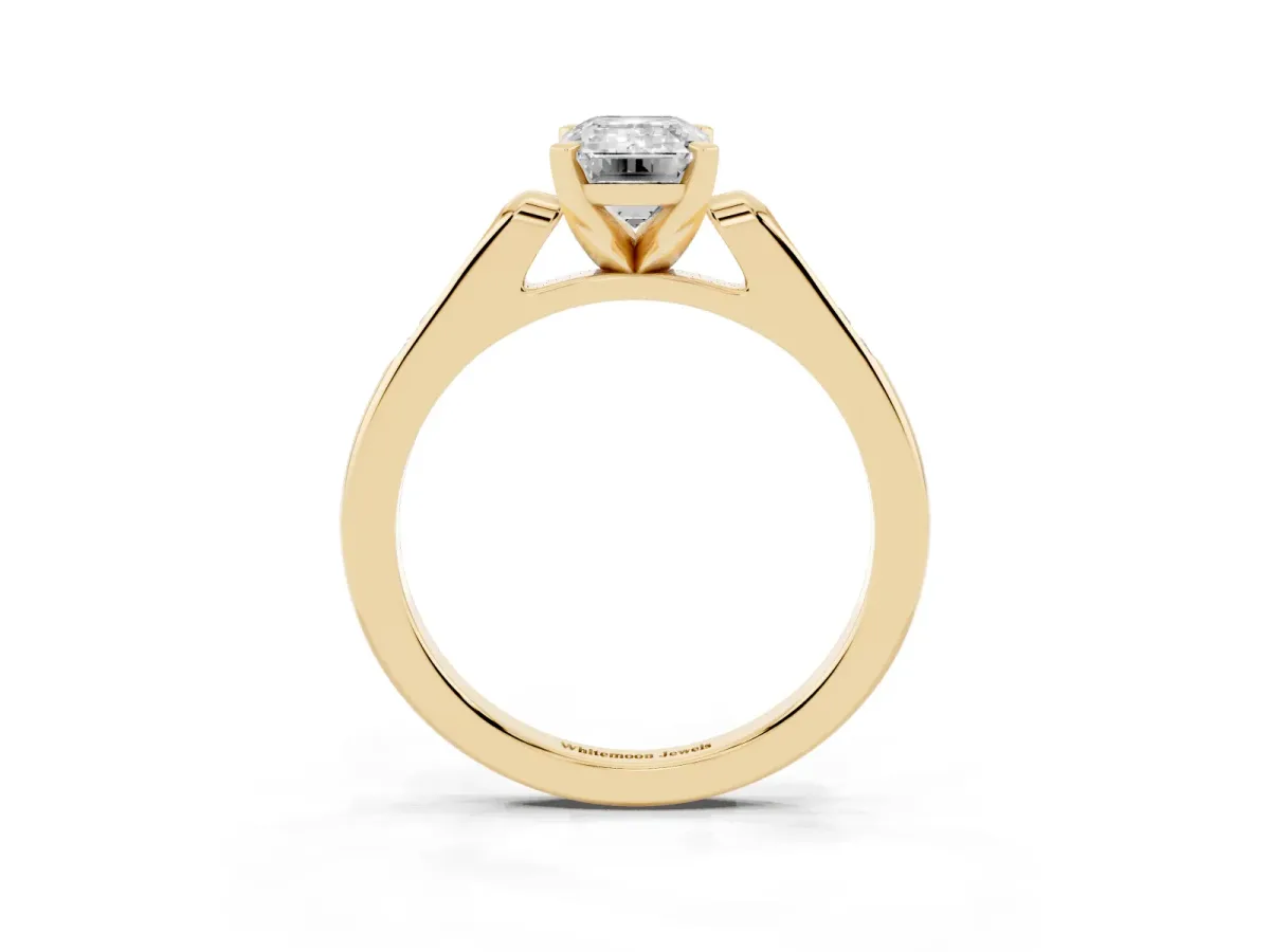 Emerald Cut Diamond Solitaire Ring with Channel Set Round Band and Prong Setting Yellow gold