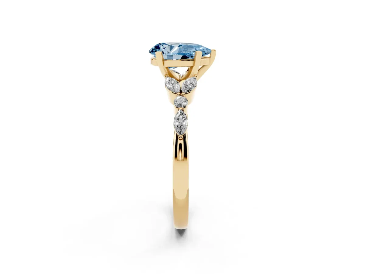 Fancy Blue Pear Cut Diamond Solitaire Ring with Side Stones and Four-Prong Setting Yellow gold