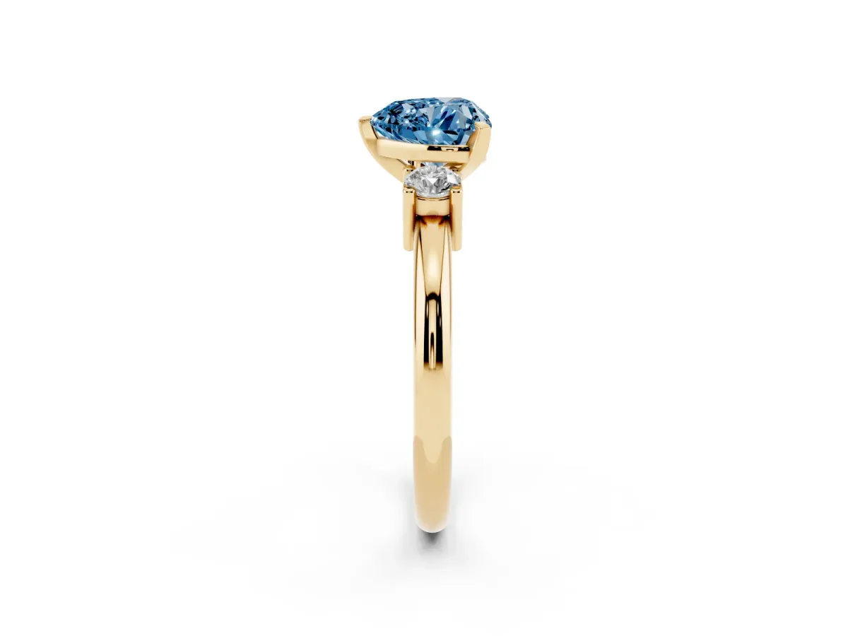 Fancy Blue Three-Stone Heart Cut Cut Diamond Solitaire with Prong Setting and Classic Band Yellow gold