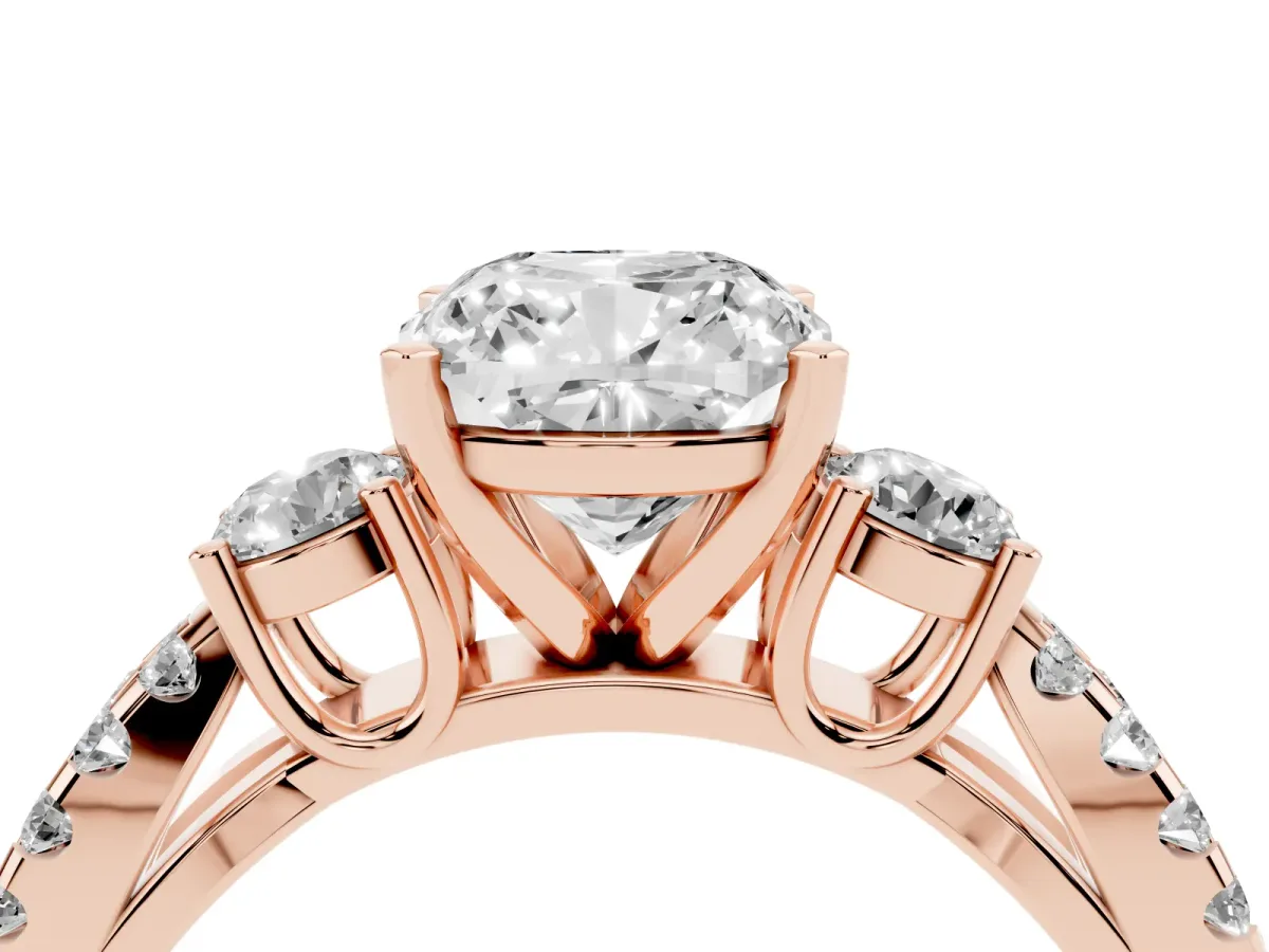 Cushion Cut Diamond Three-Stone Ring with Pavé Split Shank and Four-Prong Setting Rose gold