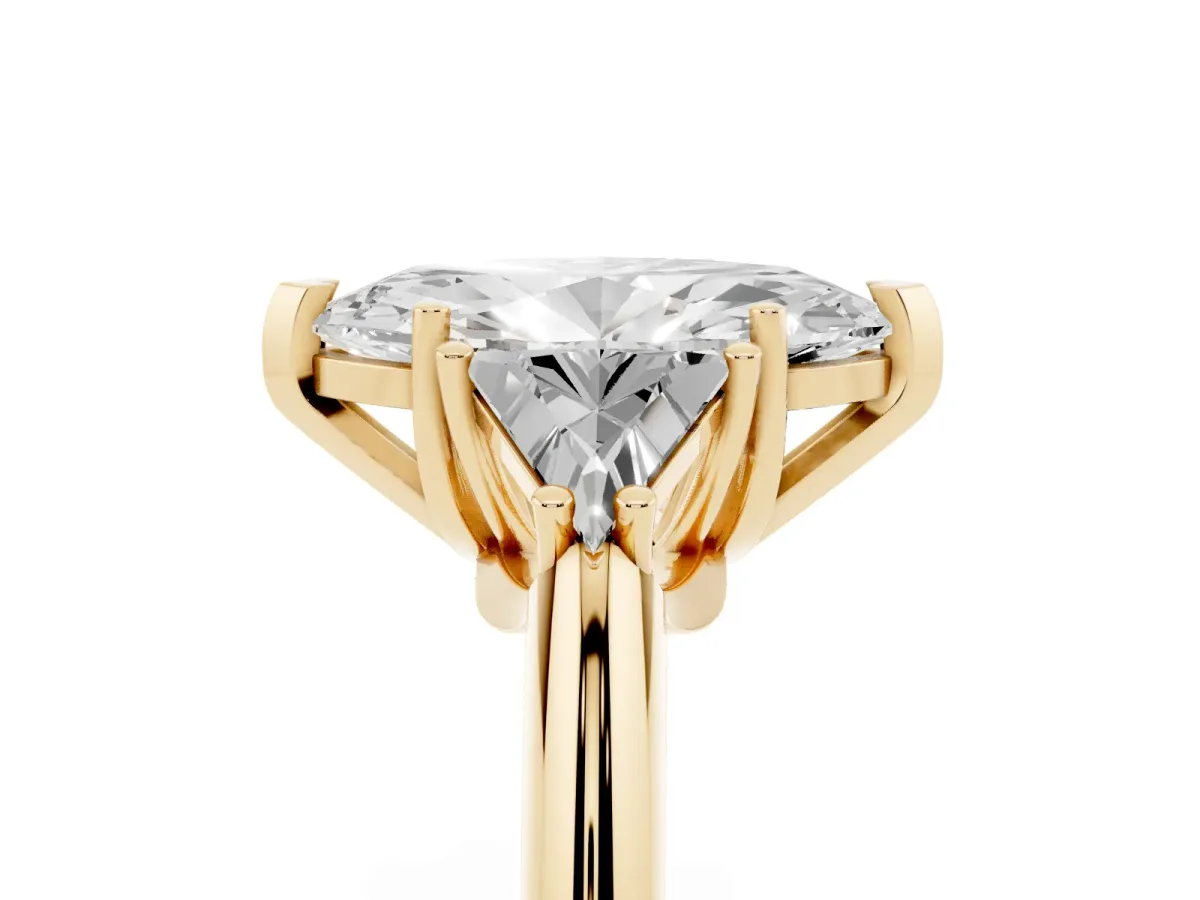 Three-Stone Marquise Cut Diamond Engagement Ring with Trillion Side Stones and Prong Setting Yellow gold