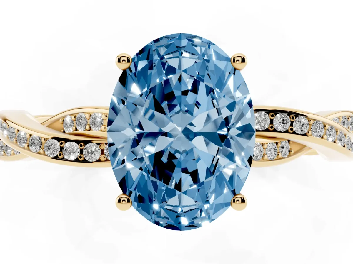 Fancy Blue Oval Cut Solitaire Twisted Pave Diamond Ring with Four-Prong Setting Yellow gold