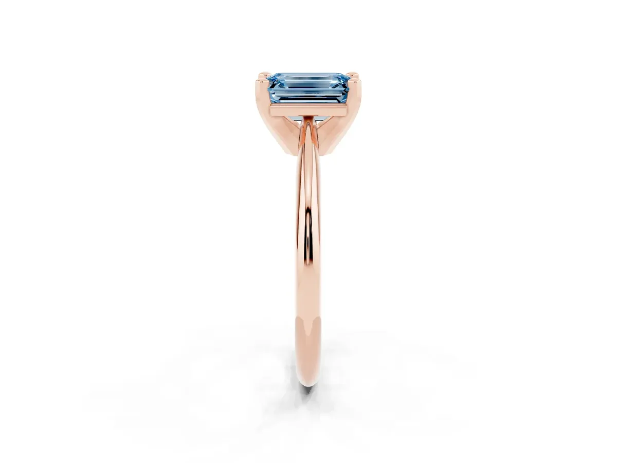 Fancy Blue Emerald Cut Cut Solitaire Ring with Four-Prong Setting on a Classic Band Rose gold