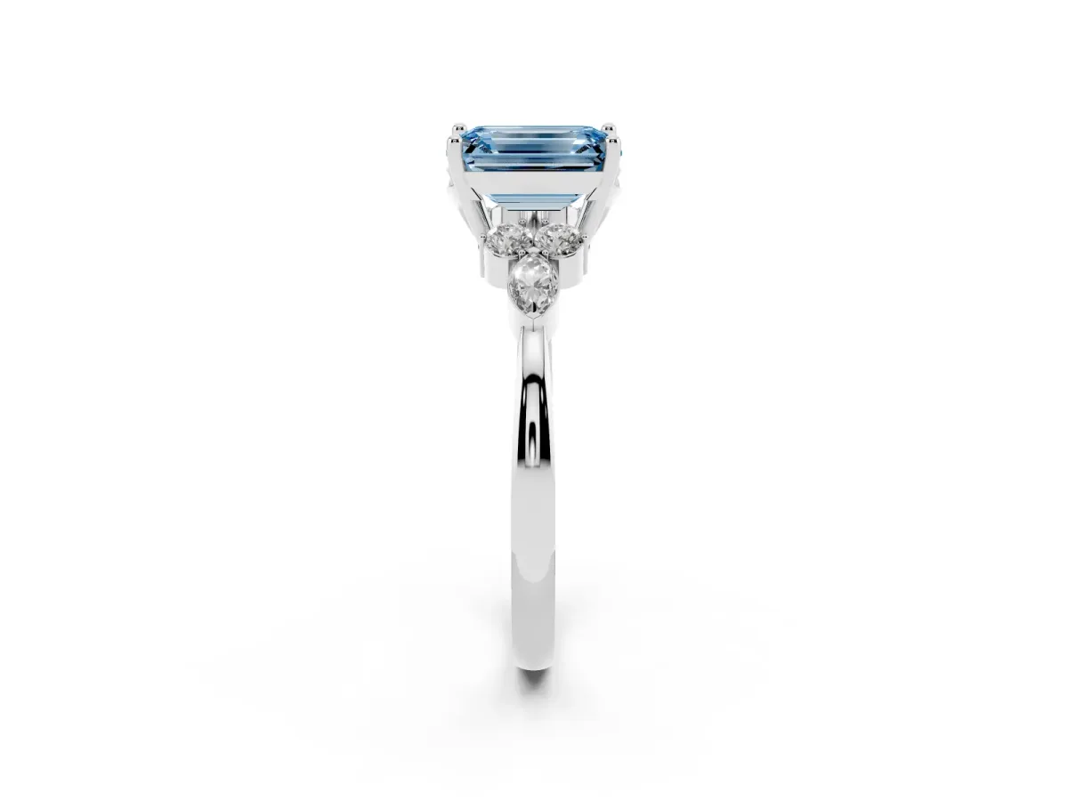 Fancy Blue Emerald Cut Brilliant Diamond Solitaire Ring with Pear Side Stones and Four-Prong Setting Silver