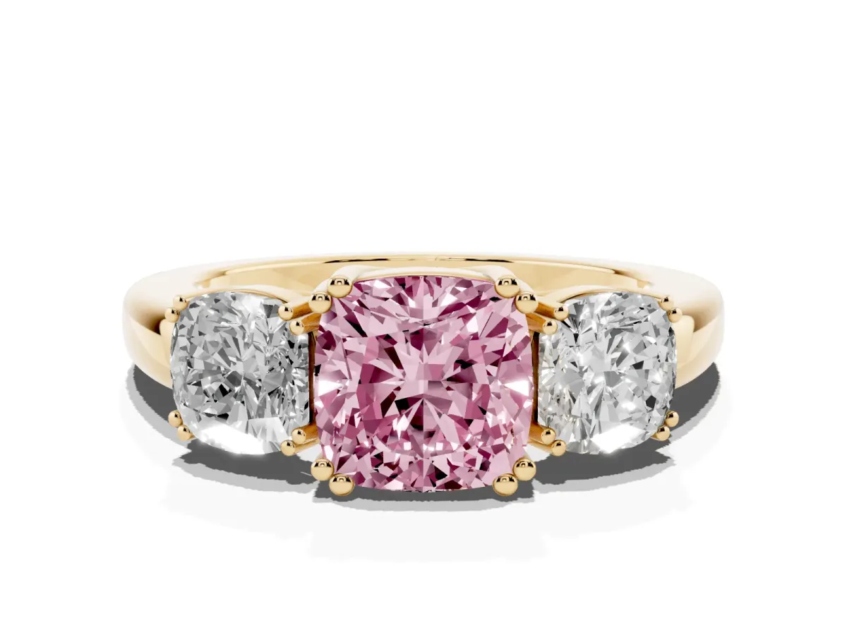 Fancy Pink Three-Stone Cushion Cut Cut Diamond Ring with Channel Set Band and Four-Prong Setting Yellow gold