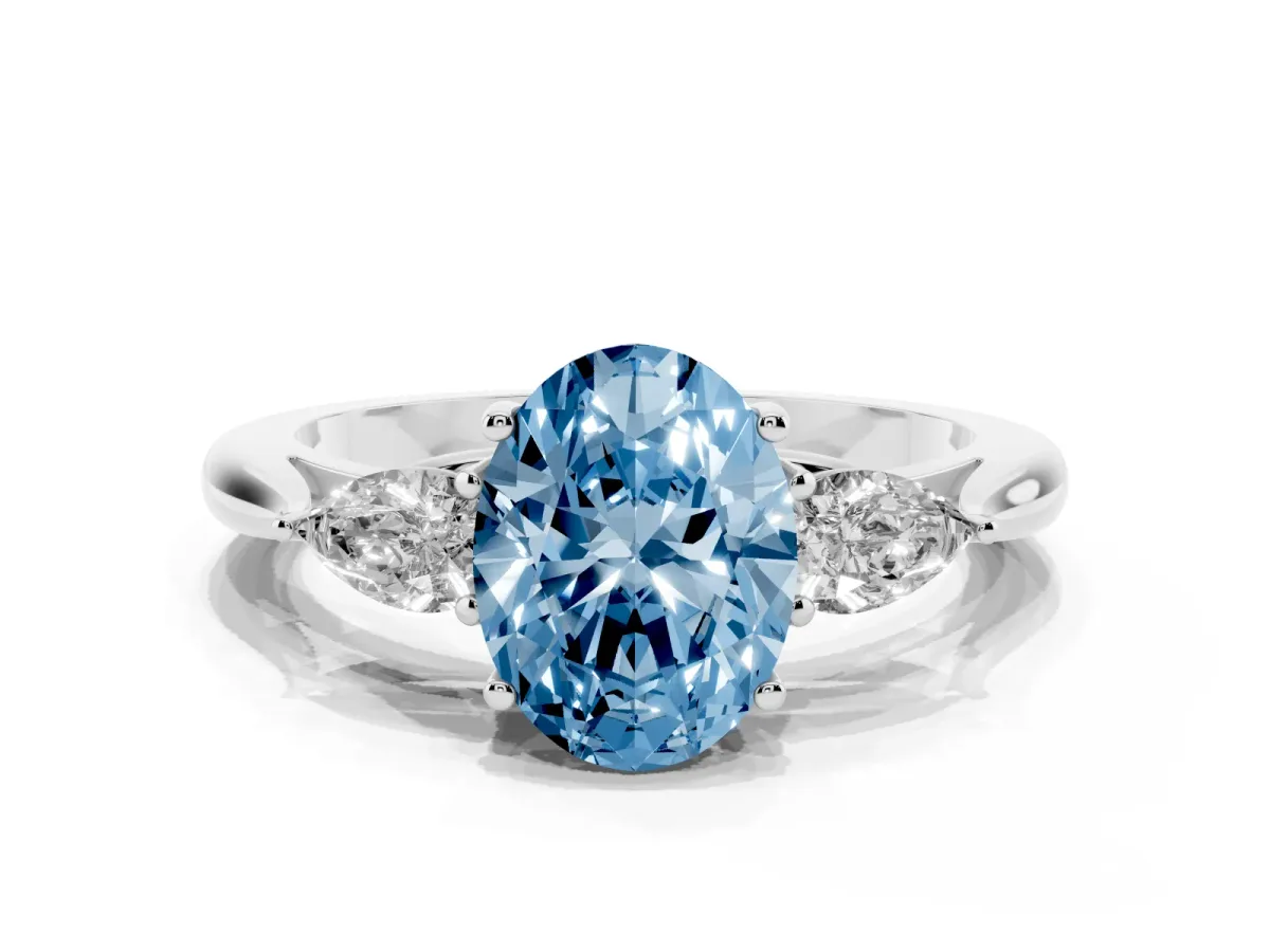Fancy Blue Three-Stone Oval Cut Diamond Ring with Pear Side Stones in Four-Prong Setting Silver
