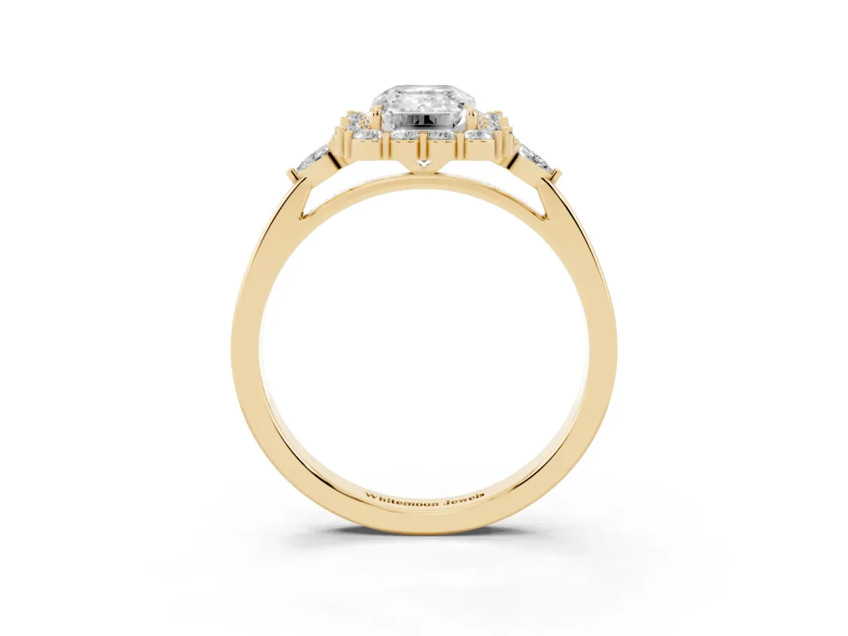 Emerald Cut Diamond Halo Ring with Pear Side Stones and Prong Setting Yellow gold