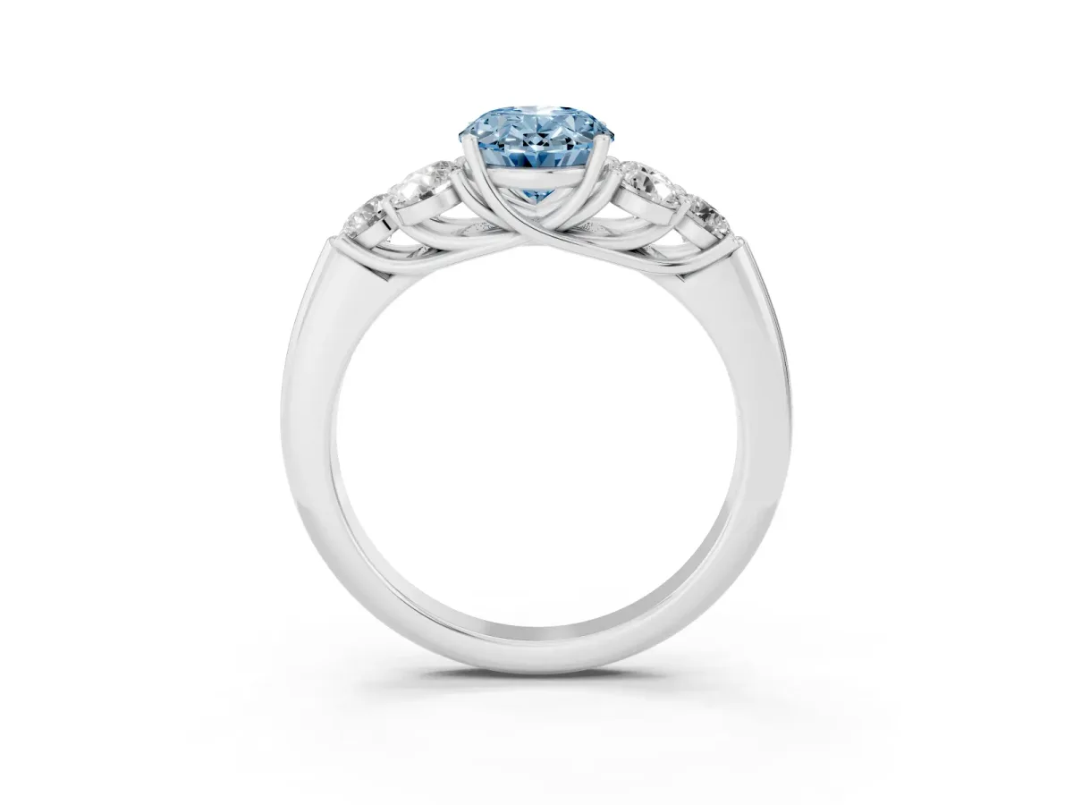 Fancy Blue Oval Cut Cut Diamond Cluster Ring with Round Accent Stones and Prong Setting on a Classic Band Silver