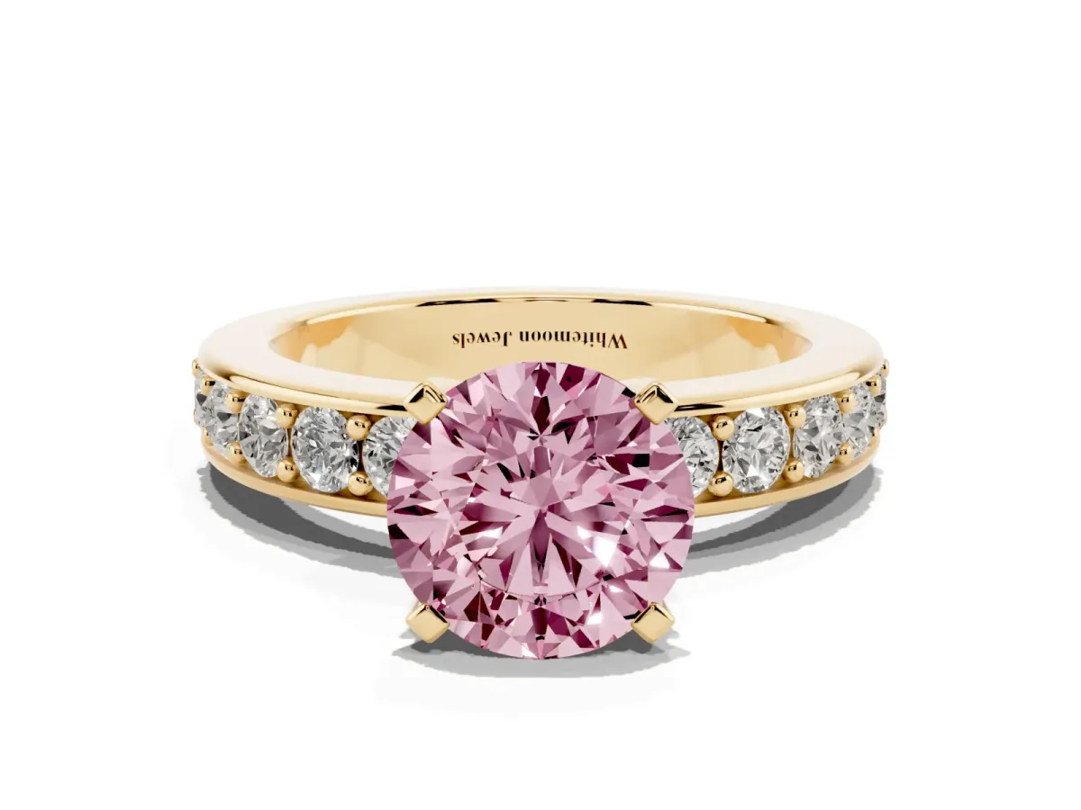 Fancy Pink Round Cut Diamond Engagement Ring with Channel Set Round Band and Prong Setting Yellow gold