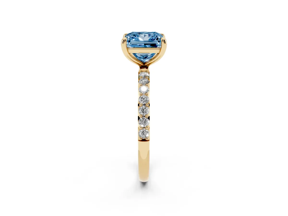 Fancy Blue Princess Cut Diamond Solitaire Ring with Round Pavé Band and Prong Setting Yellow gold