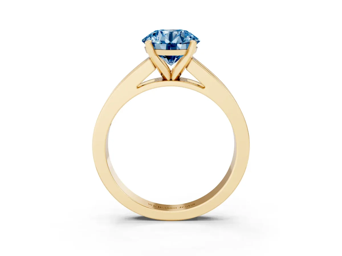 Fancy Blue Round Cut Solitaire Diamond Ring with Channel-Set Band and Four-Prong Setting Yellow gold