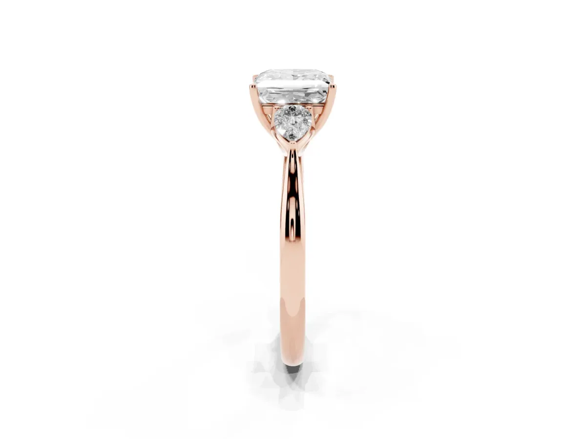 Three-Stone Princess Cut Diamond Ring with Pear Side Stones in Four-Prong Setting Rose gold