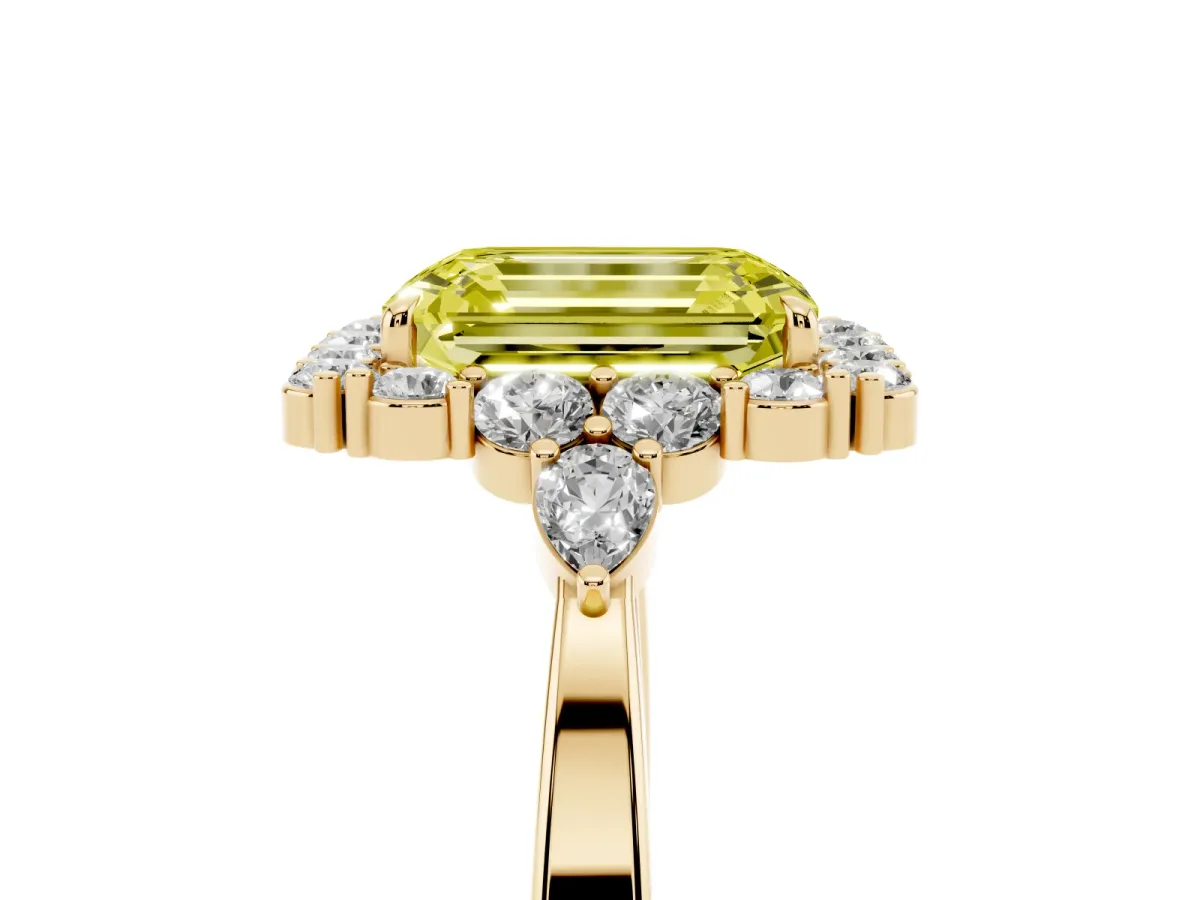 Fancy Yellow Emerald Cut Diamond Halo Ring with Pear Side Stones and Prong Setting Yellow gold