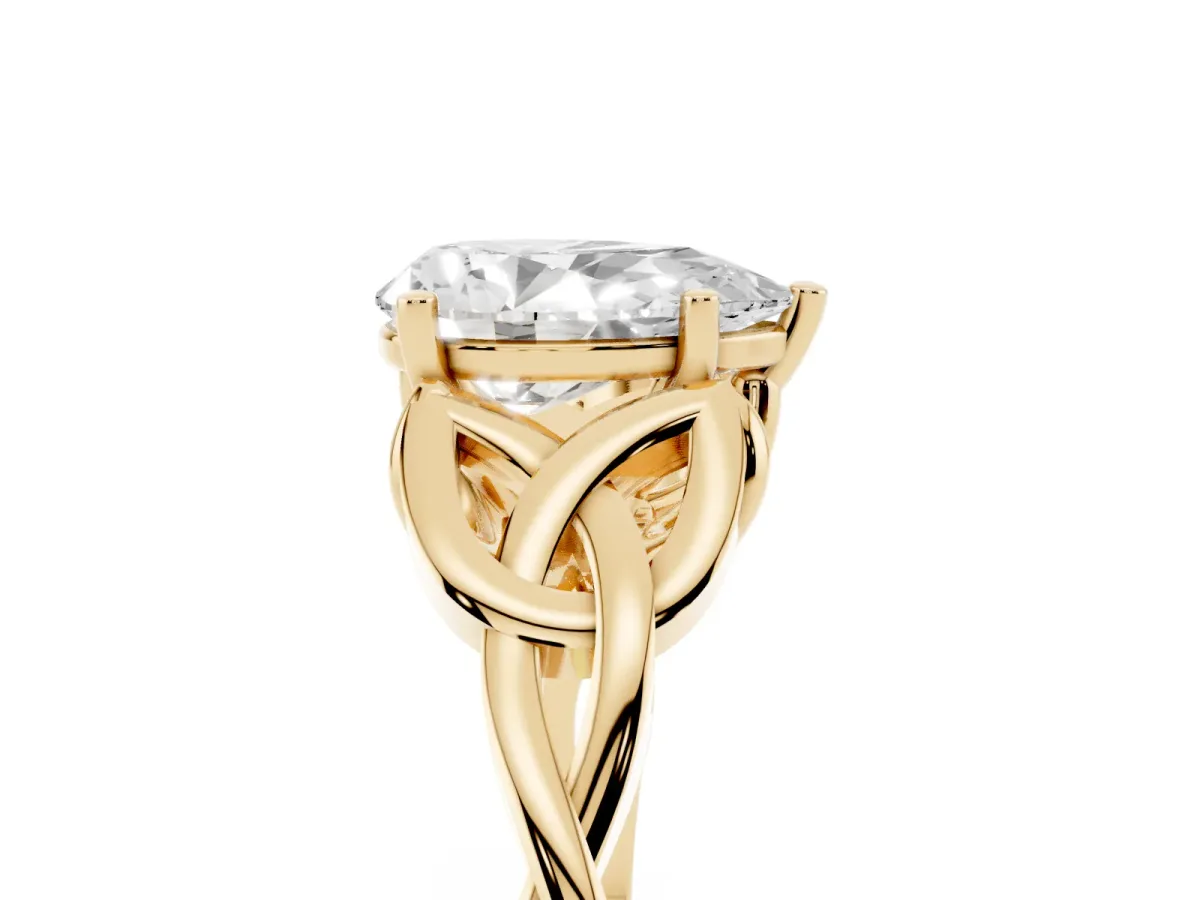 Pear Cut Diamond Solitaire Engagement Ring with Celtic Knot Band and Four-Prong Setting Yellow gold
