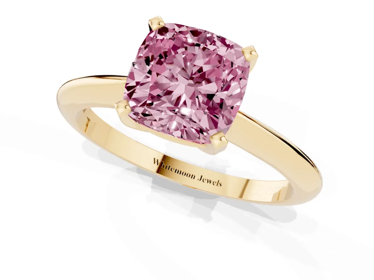 Fancy Pink Cushion Cut Cut Solitaire Ring with Four-Prong Setting on a Classic Band Yellow gold