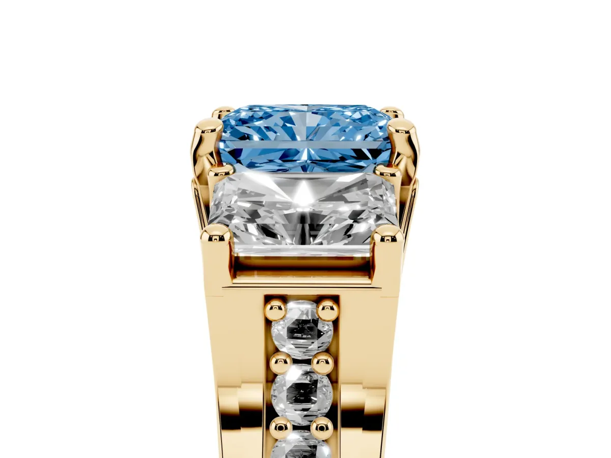 Fancy Blue Radiant Cut Diamond Three-Stone Ring with Channel Set Band and Four-Prong Setting Yellow gold