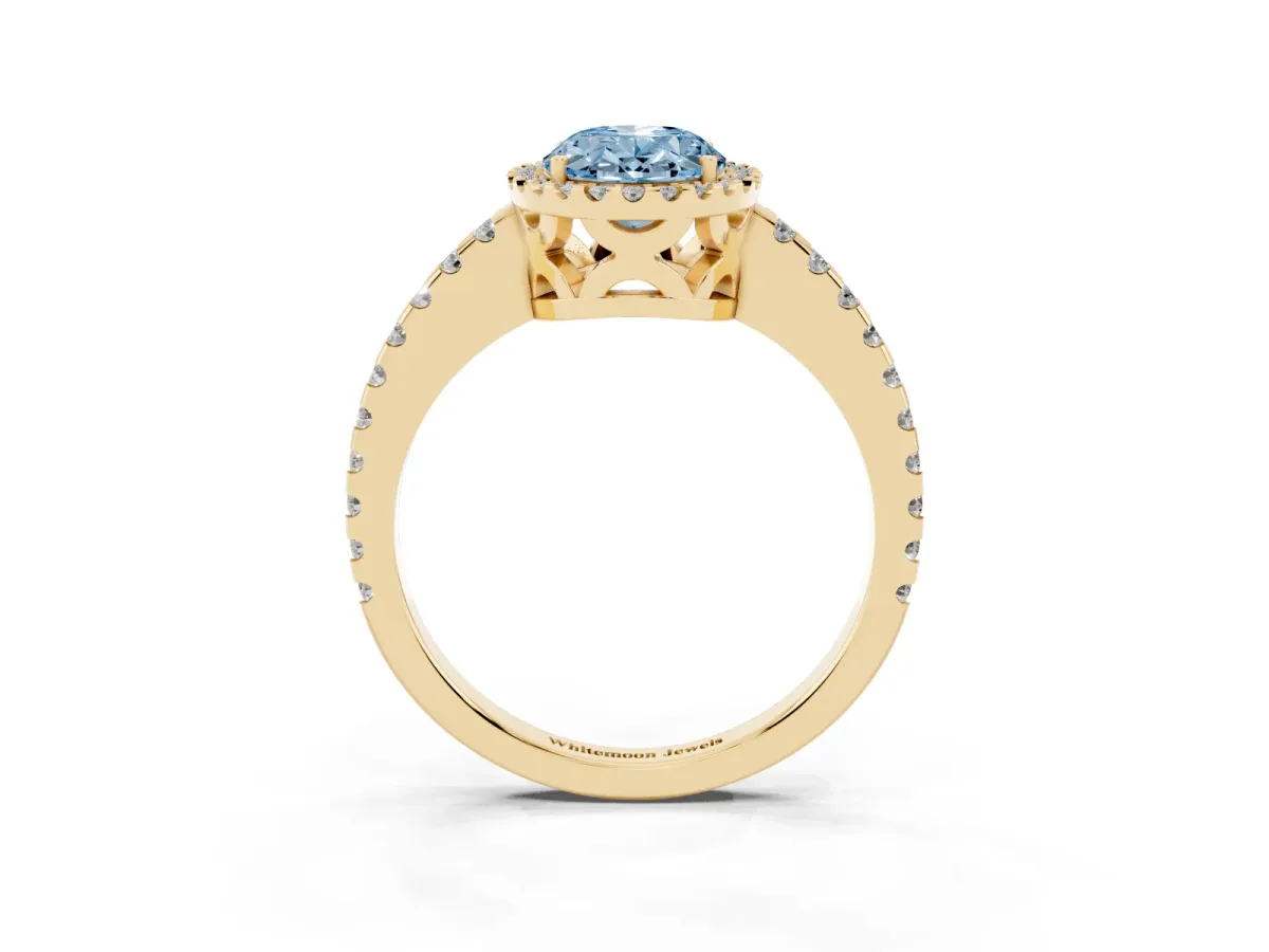Fancy Blue Oval Cut Diamond Halo Engagement Ring with Pavé Band and Prong Setting Yellow gold