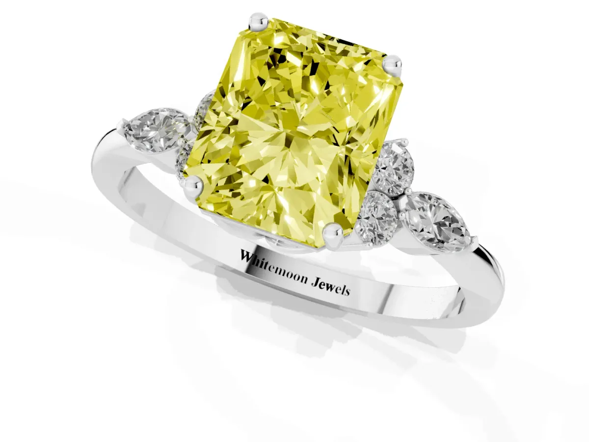 Fancy Yellow Radiant Cut Brilliant Diamond Solitaire Ring with Pear Side Stones and Four-Prong Setting Platinum