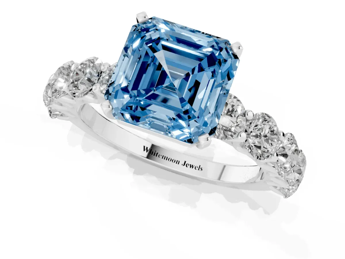 Fancy Blue Asscher Cut Diamond Prong Setting with Side Stones on a Pave Band Silver