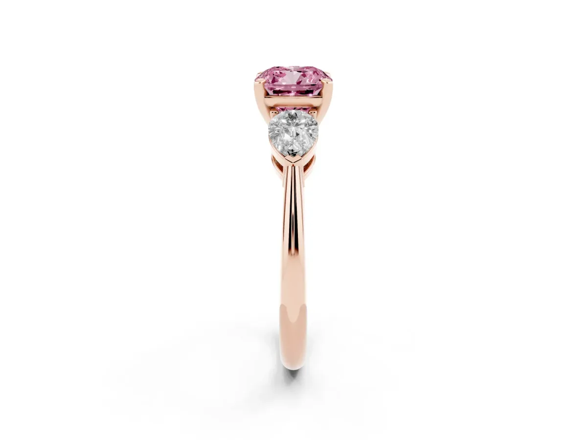 Fancy Pink Three-Stone Cushion Cut Diamond Ring with Pear Side Stones and Four-Prong Setting Rose gold