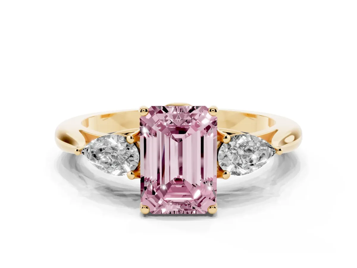 Fancy Pink Three-Stone Emerald Cut Brilliant Diamond Solitaire Ring with Tapered Band and Four-Prong Setting Yellow gold