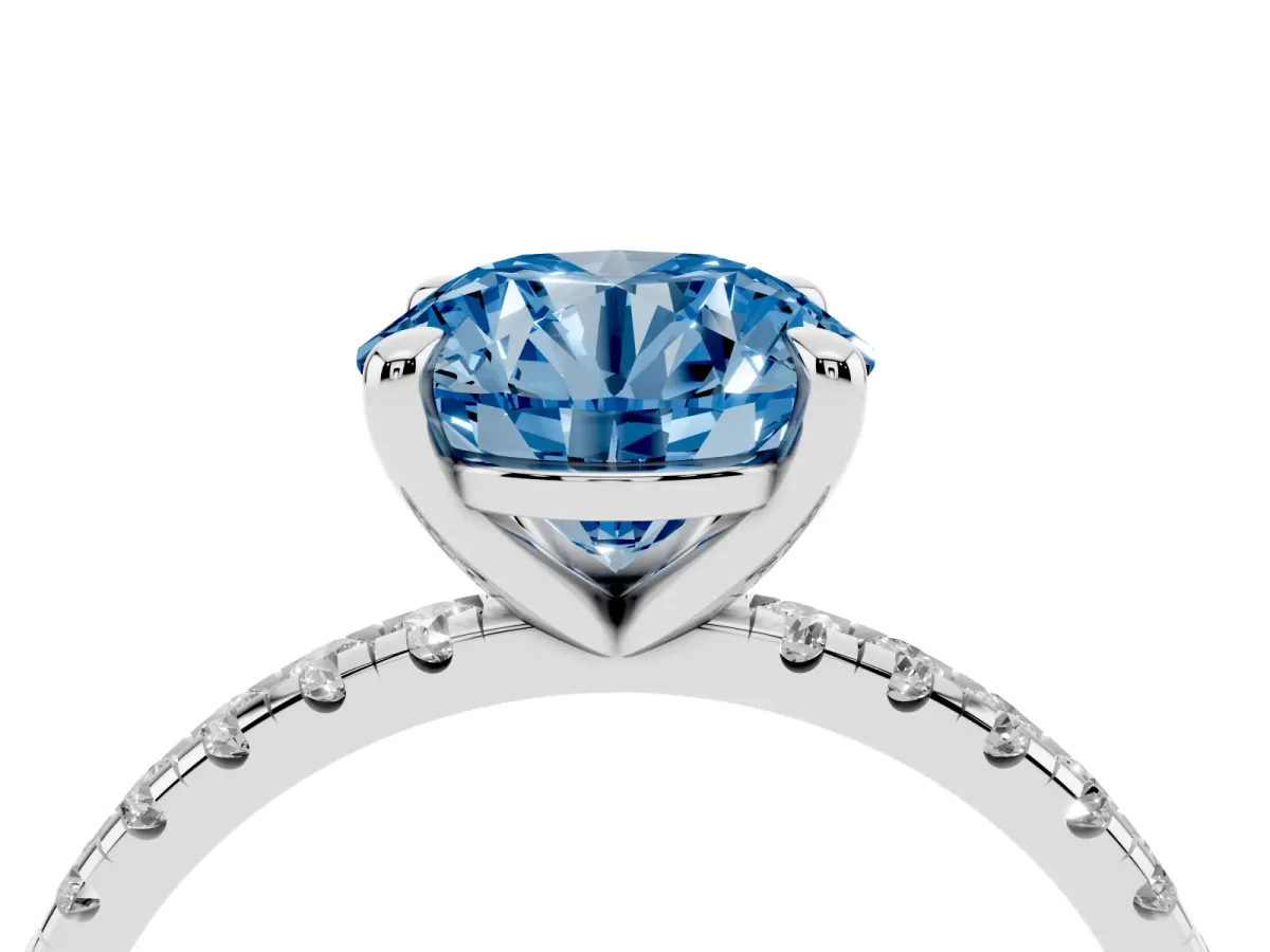 Fancy Blue Round Cut Diamond Brilliant Solitaire Ring with Pavé Band and Four-Prong Setting Platinum