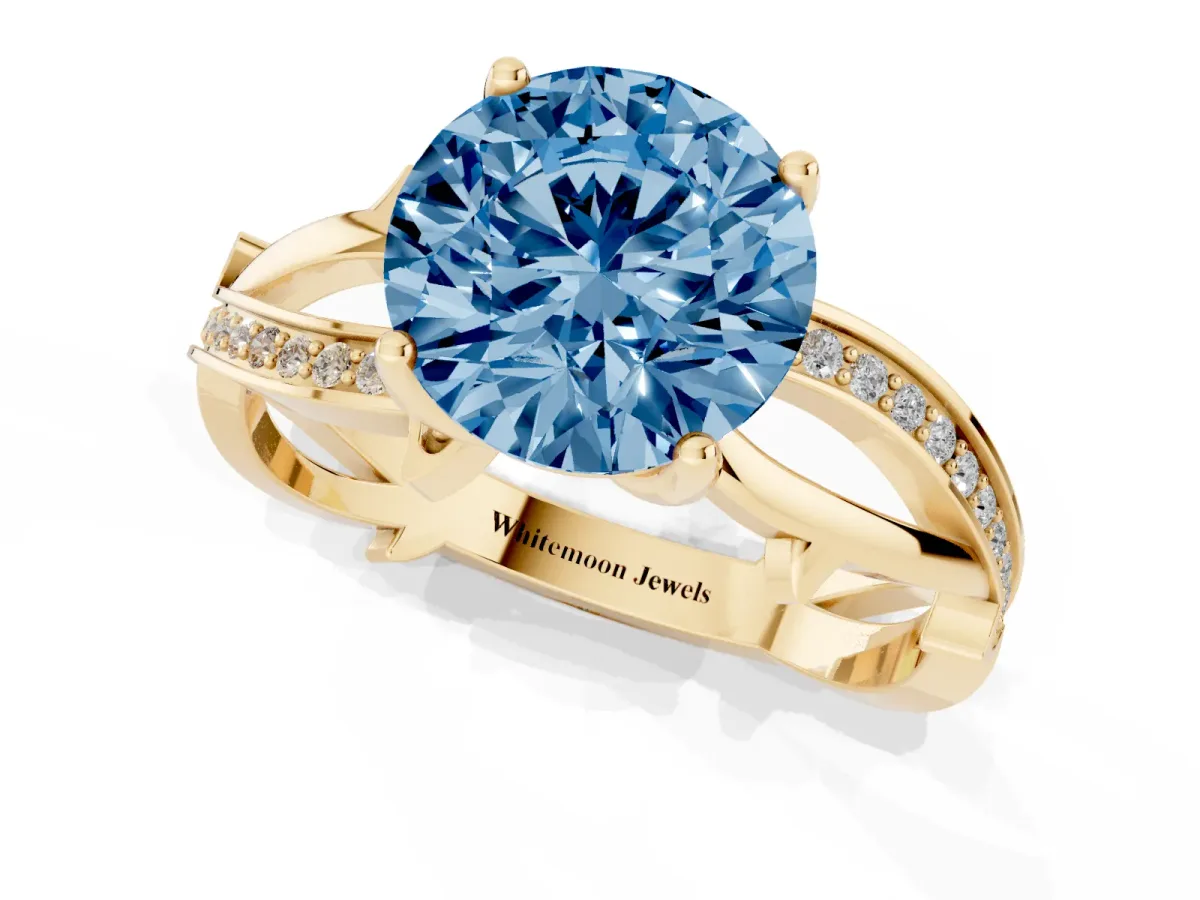 Fancy Blue Round Cut Solitaire Twist Band with Pavé Accents and Four-Prong Setting Yellow gold