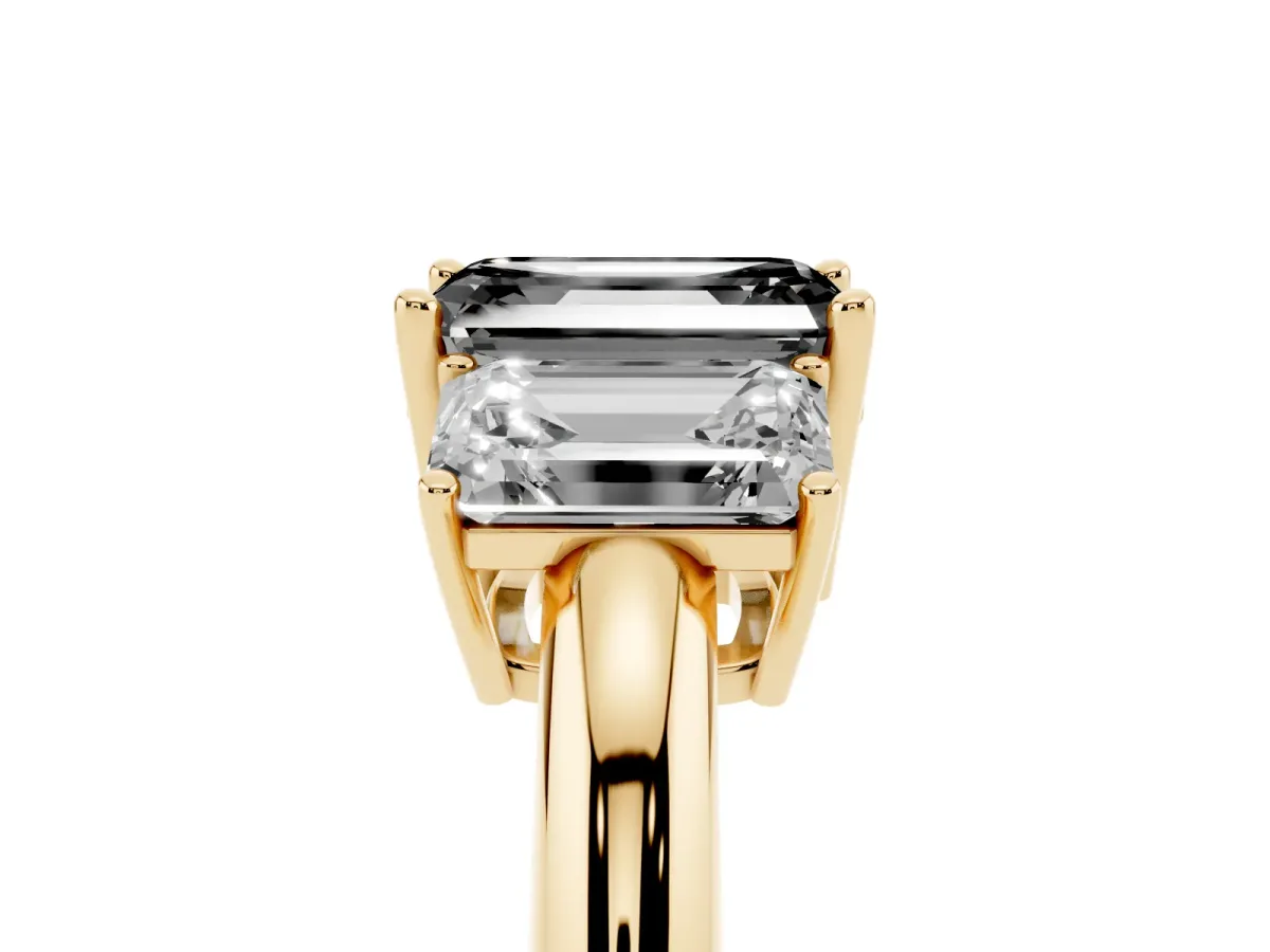 Fancy Black Three-Stone Emerald Cut Cut Diamond Engagement Ring with Prong Setting on a White Gold Band Yellow gold