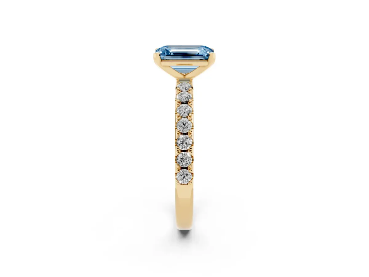 Fancy Blue Emerald Cut Diamond Solitaire Pavé Band with Four-Prong Setting Yellow gold