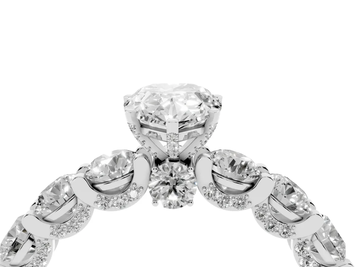 Pear Cut Diamond Side Stone Engagement Ring with Four-Prong Setting Silver