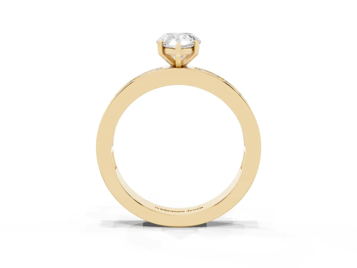 Pear Cut Solitaire Diamond Ring with Channel-Set Baguette Band and Four-Prong Setting Yellow gold