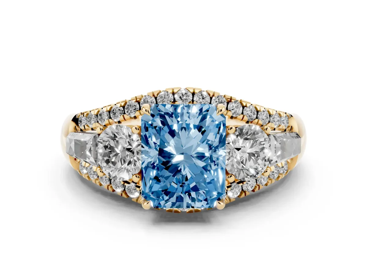 Fancy Blue Three-Stone Radiant Cut Diamond Engagement Ring with Pave Band and Prong Setting Yellow gold