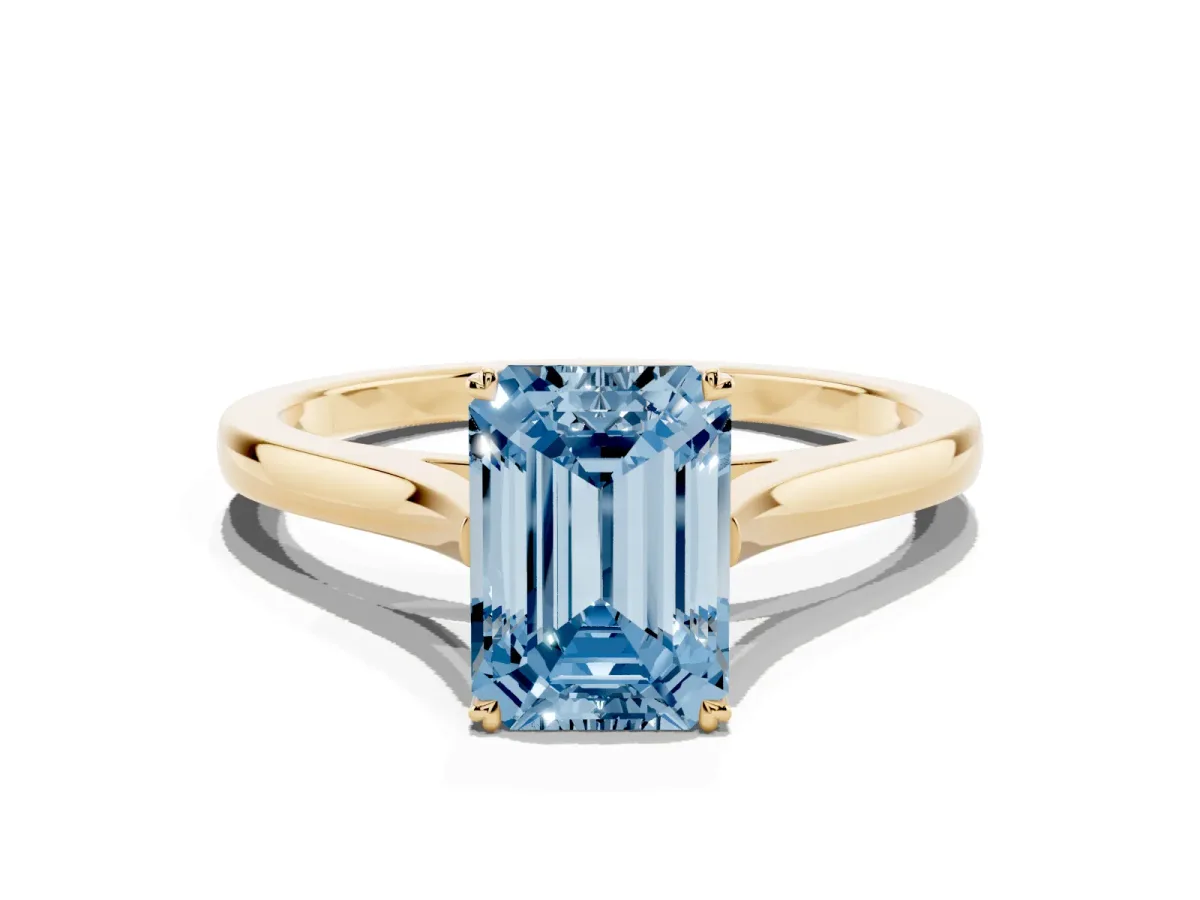 Fancy Blue Emerald Cut Solitaire Heart Prong Engagement Ring with Tapered Band Yellow gold